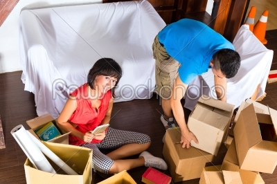 Asian couple moving in the new home