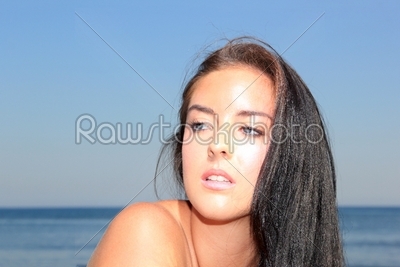 Beautiful young woman at the beach