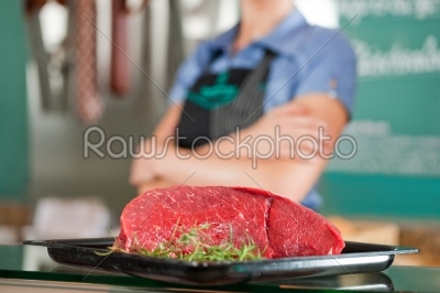 Beef with Female Butcher in Background