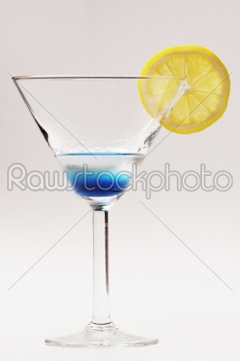 blue cocktail with yellow lemon