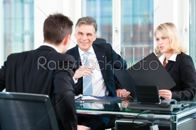 Business - young man sitting in job Interview