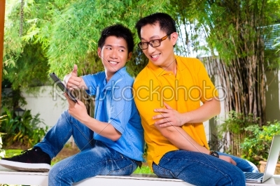 Chinese father and Asian Son at home