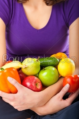 Healthy nutrition - young woman with fruits