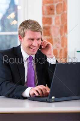 Lawyer in office sitting on the computer