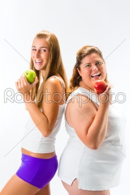 Thin and fat woman holding apple in hand