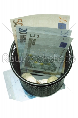 Trash with banknotes as metaphor