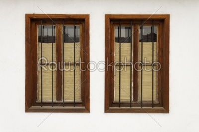 Two bulgarian old windows on white wall  