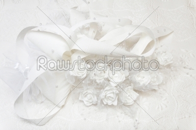 Wedding gown and decorated with white roses.  