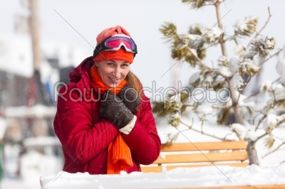 Woman in front of ski hut