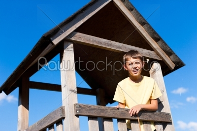 Young boy in a high seat