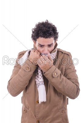 adult man in the coat covers the face with scarf