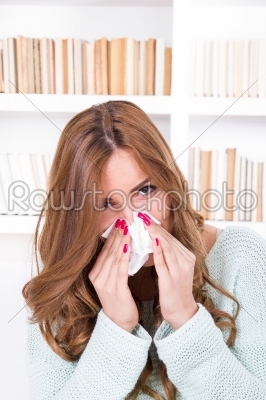 beautiful girl feeling ill caught cold sniffles blowing her nose
