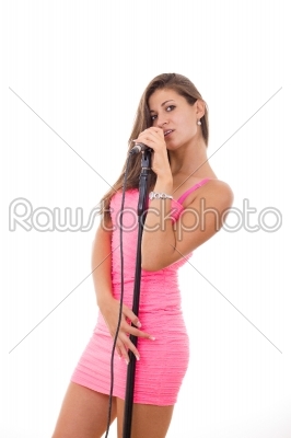 beautiful young woman singing on microphone