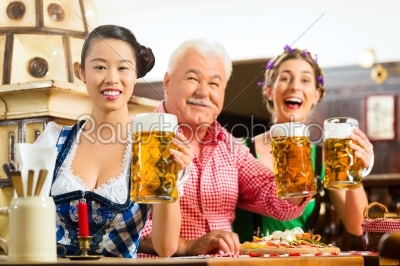 friends drinking beer in Bavarian pub