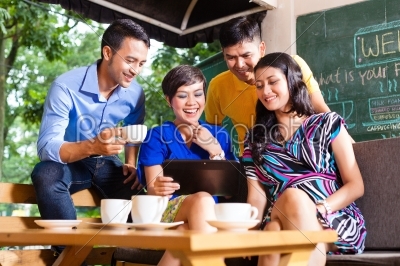 Group of young people in an Asian coffee shop