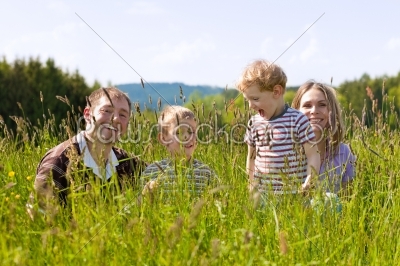 Happy family in summer outdoors