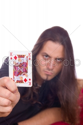 man shows the king of spades