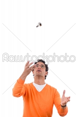 man throwing light bulb in the air
