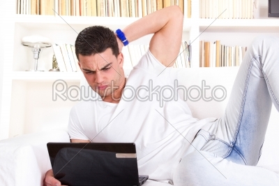 man using laptop having problems with communication and internet