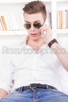 modern guy with sunglasses talking on the phone