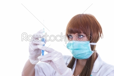 nurse with a syringe and needle in hands