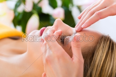Wellness - woman getting head massage in Spa