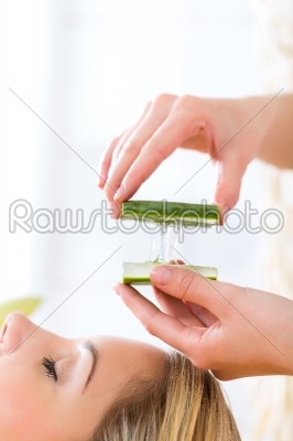 Wellness - woman having aloe vera application