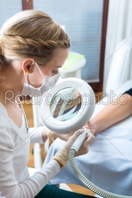 Woman receiving podiatry treatment in Day Spa